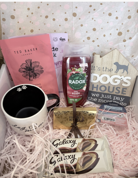 Dog mum birthday gift set - made to order. A gift box containing a mug, chocolate bars, a bottle, and dog-themed items.